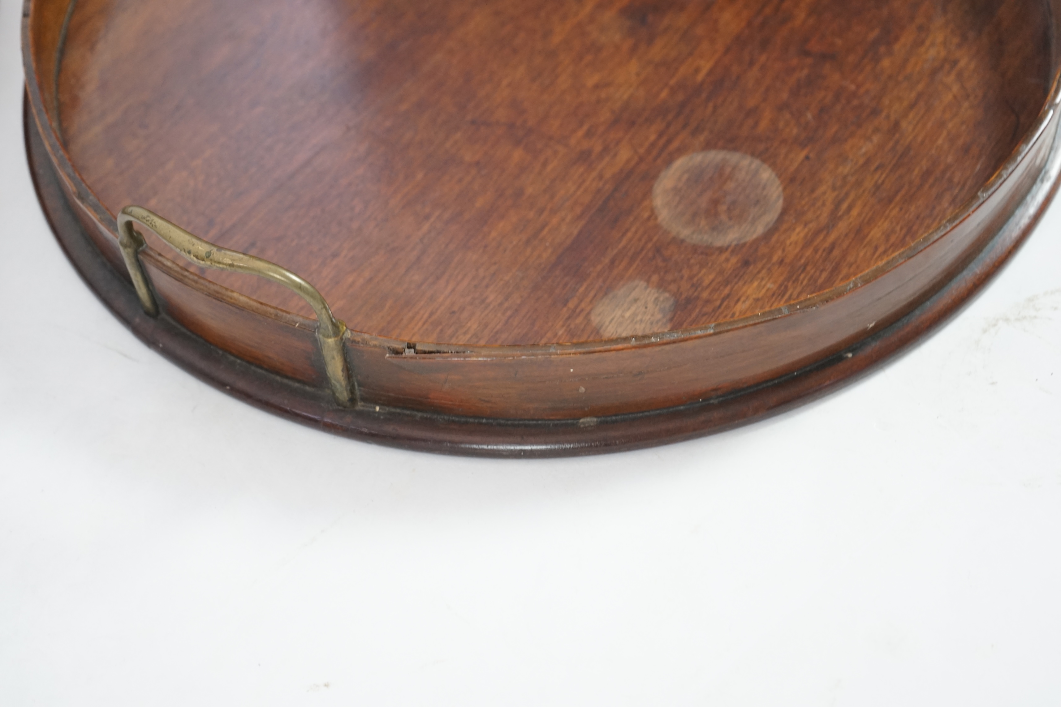 Three George III and later circular mahogany gallery trays